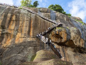 Visitors climb the stairs at Sigiriya Rock, Sri Lanka, Asia