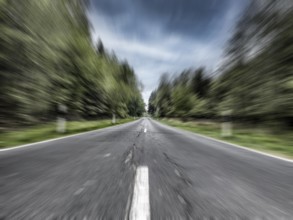 Photo with speed effect high speed speeding without speed limit from country road with central