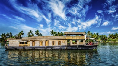 Kerala India travel background, panorama of tourist houseboat on Kerala backwaters. Kerala, India,