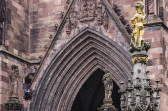 Knightly figure of St. George and details on the main portal of the Cathedral of Our Lady, Freiburg