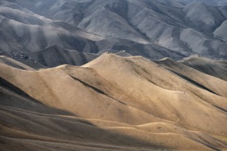 View of mountain landscape with rolling grassy hills at Tyibel Pass, Song Kul Too mountain range,