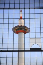 Kyoto Tower, reflected in the glass facade of the central station, Kyoto, Japan, Asia