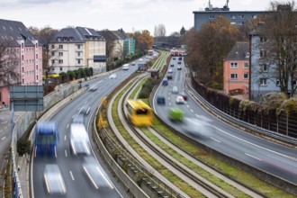 Motorway A40, Ruhrschnellweg, skyline of the city centre of Essen, exit Essen-Huttrop, track bus