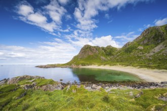 Sandy beach beach in bay with mountains, Skipssanden, near Stø, Dronningruta hike, Langøya Island,