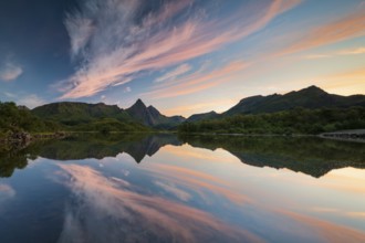 Mountains and clouds reflected in the sea, evening mood, near Stø, Langøya Island, Vesterålen,