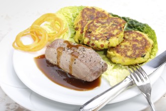 Swabian cuisine, medallions of wild boar with savoy cabbage cakes, meat dish, roasted, hearty, home