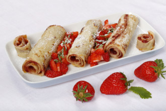 Swabian cuisine, filled pancakes, Flädle with strawberry jam and icing sugar, Gsälz, fresh