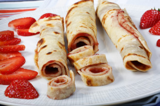 Swabian cuisine, filled pancakes, Flädle with strawberry jam, Gsälz, fresh strawberries, sweet,