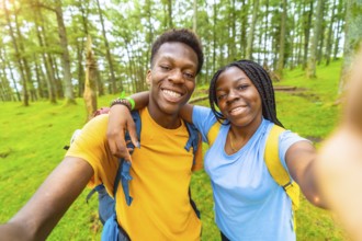 African friends during selfie moment while hiking in the forest
