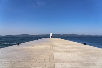 Small white lighthouse on the pier in Zadar, Croatia, Europe