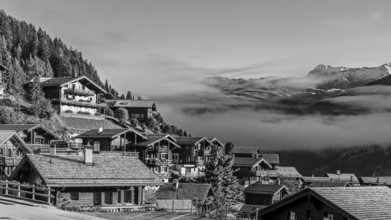 Roofs covered with hoarfrost, fog rising, black and white photo, Grimentz, Val d'Anniviers, Valais