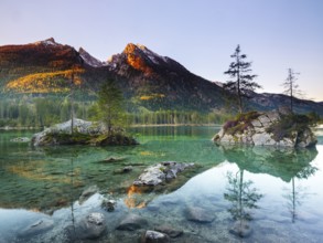 Hintersee in the morning, behind the peaks of the Hochkalter in the first sunlight, Berchtesgaden