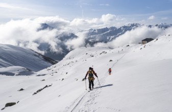 Ski tourers in a wintry mountain landscape, Bündner Haute Route ski tour, Albula Alps, Rhaetian