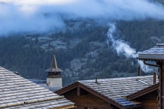 Roofs covered with hoarfrost, fog rising, Grimentz, Val d'Anniviers, Valais Alps, Canton Valais,