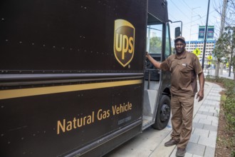 New Orleans, Louisiana - A United Parcel Service driver and his natural gas powered 'package car'