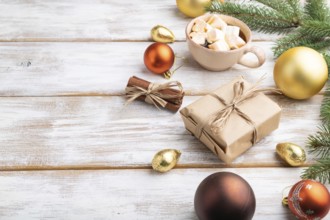Christmas or New Year composition. Decorations, box, golden balls, cinnamon, fir and spruce