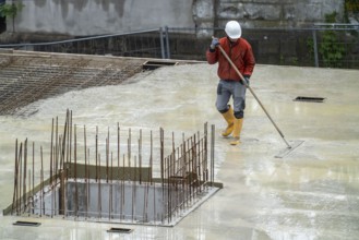 Construction site, concreting, the floor slab of a building is concreted, the fresh concrete is