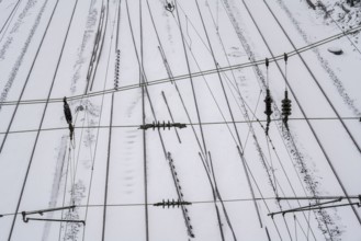 Onset of winter with lots of fresh snow and temperatures below -5 degrees during the day, railway