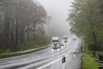 Traffic on a country road in the rain, B229, spring, near Radevormwalde, Oberbergischer Kreis,
