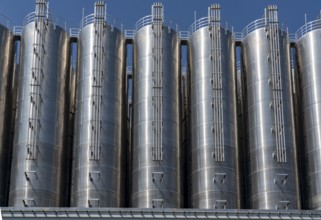 Stainless steel tanks of a large silo facility in Duisburg inland harbour, Duisburg-Neuenkamp, for
