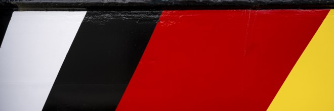 Black, red, gold, colours of the German flag on the hull, Lower Saxony, Germany, Europe