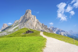 Scenic view of idyllic valley with hiking trail leading to refuge at the foot of majestic nuvolau