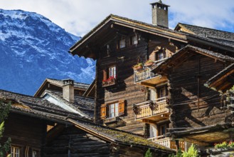 Old snow-covered wooden houses in the historic village centre, Grimentz, Val d'Anniviers, Valais