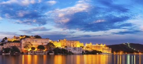 Panorama of famous romantic luxury Rajasthan indian tourist landmark, Udaipur City Palace in the