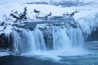 Godafoss waterfall, icy and snowy rock face, snowy landscape, Northern Iceland Eyestra, Iceland,