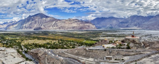 Panorama of Nubra valley in Himalayas with giant Buddha statue in Diskit, Ladakh, India, Asia