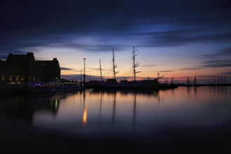 Sail training ship Gorch Fock, long exposure at dusk, backlight, Stralsund harbour, Germany, Europe