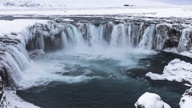 Godafoss waterfall, icy and snowy rock face, snowy landscape, Northern Iceland Eyestra, Iceland,