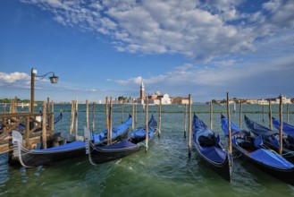 Gondolas and in lagoon of Venice by Saint Mark (San Marco) square with San Giorgio di Maggiore