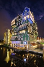 ZAANDAM, NETHERLANDS, MAY 21, 2018: Inntel Hotel in Zaandam illuminated at night. Design of