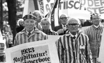 Nazi victims, some in concentration camp uniforms, demonstrated against the occupational bans
