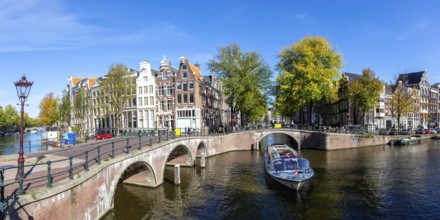 Canals and bridges building panorama at the Keizersgracht in the city of Amsterdam, Netherlands