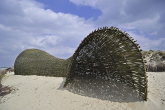 Sandworm by artist Marco Casagrande in the dunes during Beaufort04 at De Haan, Wenduine, Belgium,