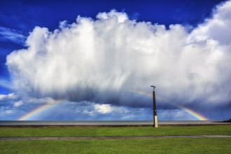 Seaside promenade, dramatic cloudy sky with rainbow, Bray, Wicklow, Ireland, Europe