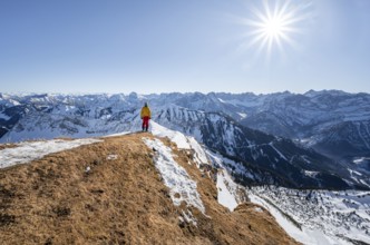 Ski tourers at the summit of Schafreuter, view of snowy mountain panorama, Sonnenstern, Karwendel,