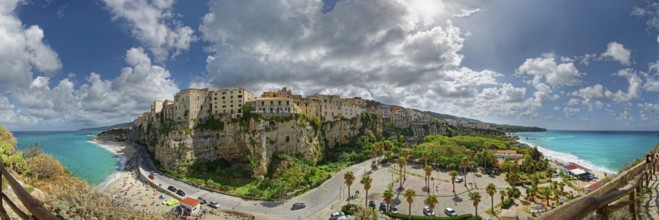 Panorama of the medieval old town of Tropea perched on rocks of sandstone with its turquoise sea