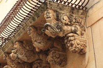 Old town of the late Baroque city of Noto in the Val di Noto, balcony at Palazzo Nicolaci di