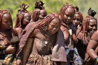 Mourning Himba women at a funeral, the widow in the middle, Omohanja, Kaokoland, Kunene, Namibia,