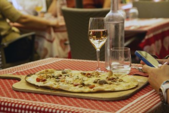 Alsatian tarte flambée in a street café in the historic centre of Strasbourg