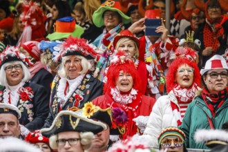 Colourfully costumed carnivalists celebrate carnival in Cologne, on Weiberfastnacht the street