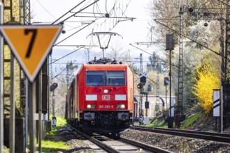 Goods train with a Deutsche Bahn AG locomotive travelling on the open track. Stuttgart,