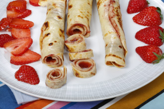 Swabian cuisine, filled pancakes, Flädle with strawberry jam, Gsälz, fresh strawberries, sweet,