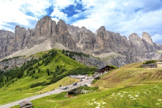 Breathtaking landscape showing the winding road of passo gardena and the majestic mountain range of