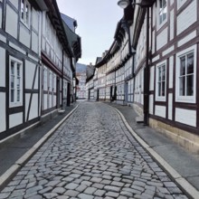 Narrow alley with half-timbered houses and cobblestones in the old town, UNESCO World Heritage