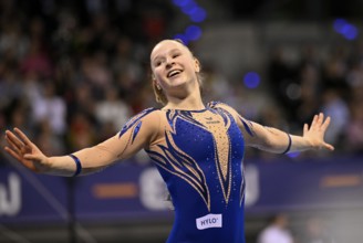 Silja Stöhr GER cheers after her routine on the balance beam Gymnastics action, EnBW DTB-Pokal,