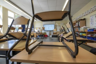 Classroom of a fourth grade, after school, the building is older but in good condition, modern